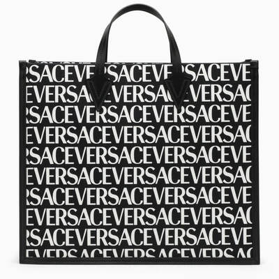 Shop Versace Black Tote Bag With All-over Logo In V Nero/bianco/oro