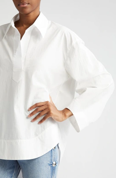 Shop Khaite Melan Curve Hem Cotton Popover Blouse In White