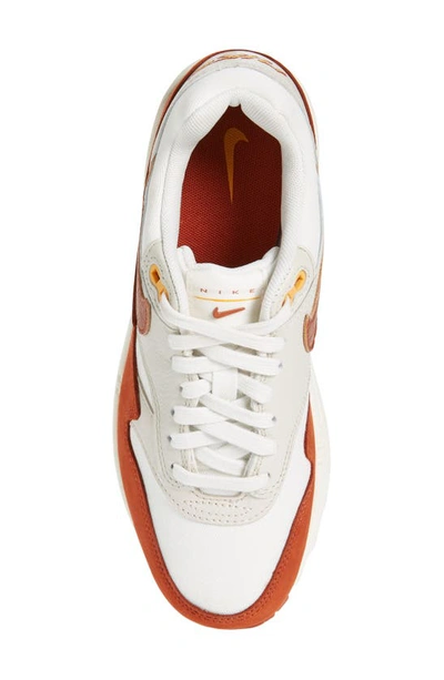 Shop Nike Gender Inclusive Air Max 1 Lx Sneaker In Sail/ Rugged Orange/ Brown