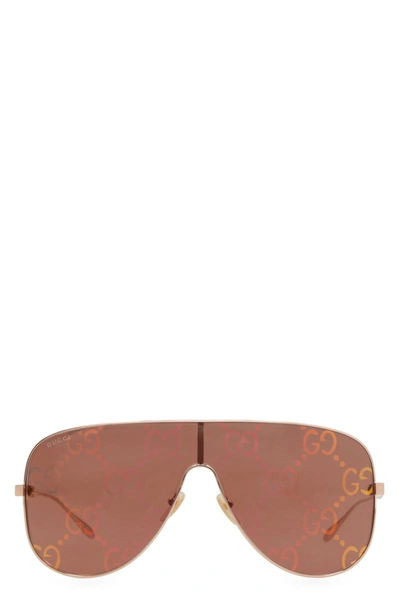 Shop Gucci Visor Sunglasses In Gold