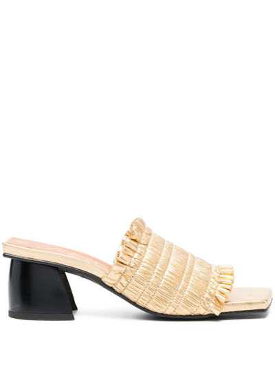 Shop Ganni Smock 65mm Ruched Mules In Gold