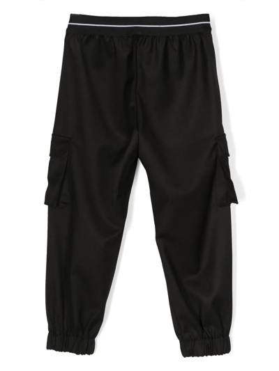 Shop Msgm Black Cargo Trousers With Logo Waistband In Nero