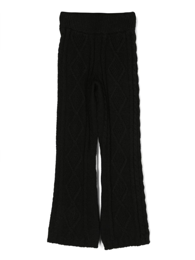 Shop Msgm Black Braided Knitted Trousers In Nero
