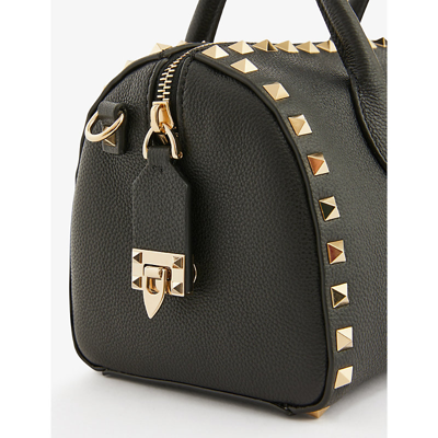 Shop Valentino Garavani Nero Gold Rockstud Grained-leather Bowling Bag