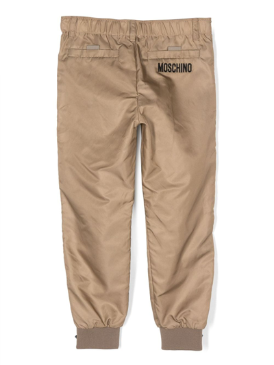 Shop Moschino Tapered Cargo Trousers In Brown