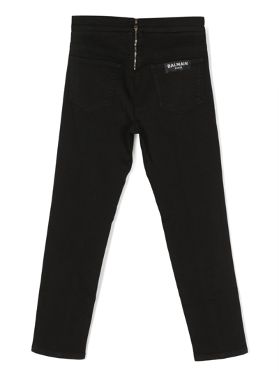 Shop Balmain Embossed-button Detail Trousers In Black