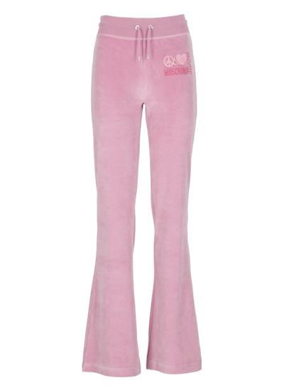 Shop Moschino Jeans Logo Embroidered Flared Trousers In Pink
