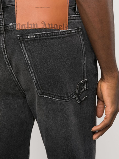 Shop Palm Angels Monogram-patch Slim Jeans In Black