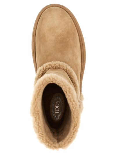 Shop Tod's Winter Gommini Boots In Beige