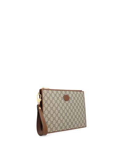 Shop Gucci Logo Jacquard Zipped Clutch Bag In Brown