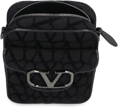 Shop Valentino Garavani - Locò Crossbody Bag In Black
