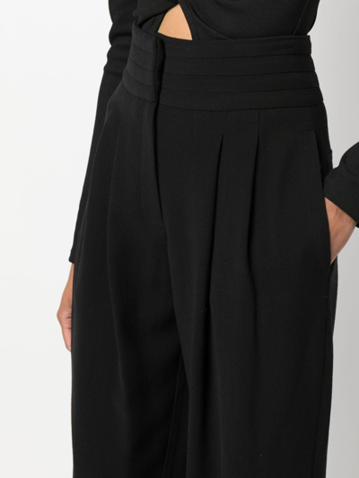 Shop Iro Pleat-detail Wide-leg Trousers In Black