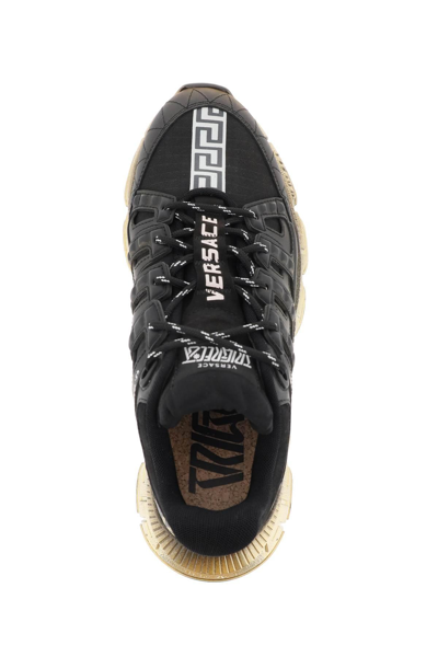 Shop Versace 'trigreca' Sneakers In Black,gold