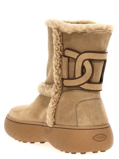 Shop Tod's Winter Gommini Boots, Ankle Boots Beige