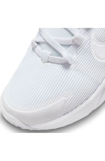 Shop Nike Kids' Star Runner 4 Sneaker In White/ White/ White/ Platinum