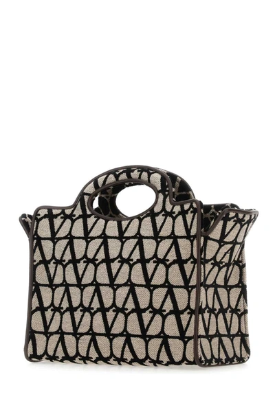 Shop Valentino Garavani Handbags. In Printed