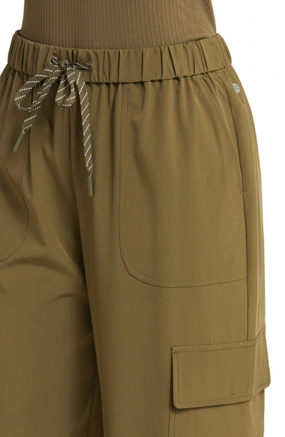 Shop Zella Interval Utility Cargo Pants In Olive Night