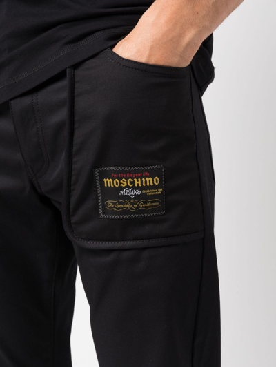 Shop Moschino Logo-patch Straight-leg Trousers In Black