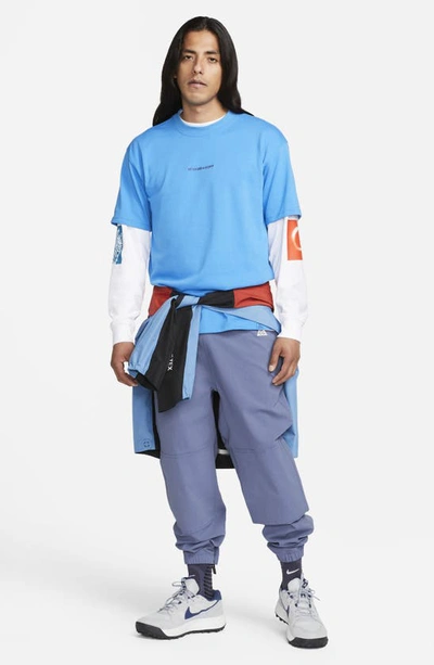 Shop Nike Acg Water Repellent Trail Pants In Diffused Blue/ Summit White