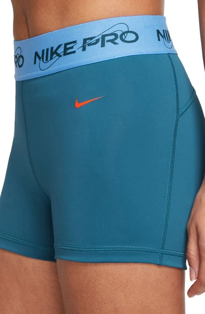 Shop Nike Pro Mid Rise Graphic Training Shorts In Industrial Blue/ Blue