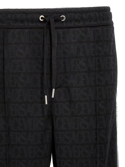 Shop Versace Logo Joggers Pants Black