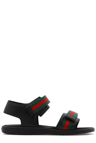 Shop Gucci Kids Logo Detailed Open Toe Sandals In Black