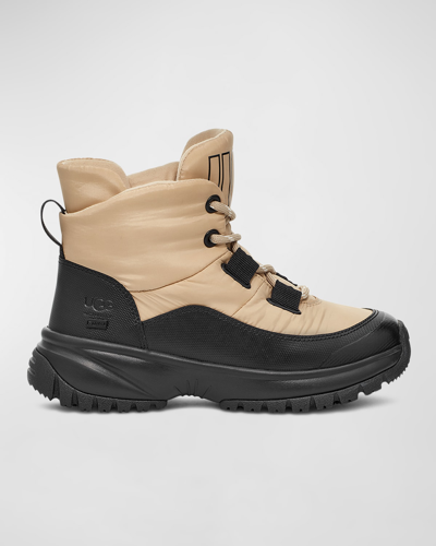 Shop Ugg Yose Puffer Lace-up Hiker Boots In Mustard Seed