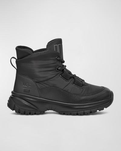 Shop Ugg Yose Puffer Lace-up Hiker Boots In Black