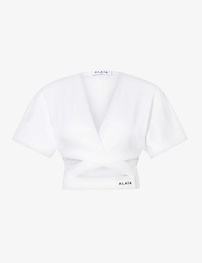 Shop Alaïa Alaia Women's Blanc Cross-over Brand-typography Cotton T-shirt