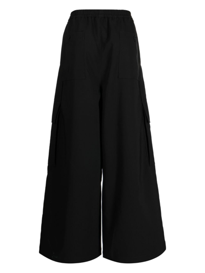 Shop Yoshiokubo Temple Multiple-pocket Trousers In Black