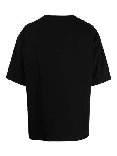 Shop Yoshiokubo Slogan-print Cotton T-shirt In Black