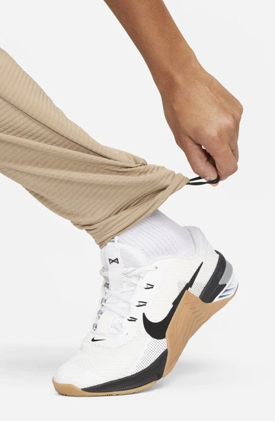 Shop Nike Pro Fleece Fitness Pants In Khaki/ Black