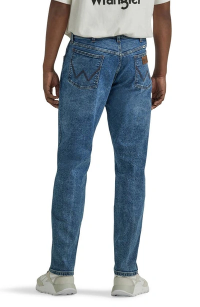 Shop Wrangler Relaxed Tapered Jeans In Gitty Up Blue
