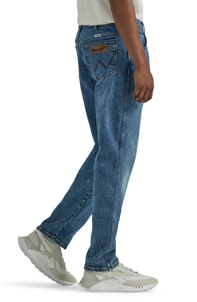 Shop Wrangler Relaxed Tapered Jeans In Gitty Up Blue
