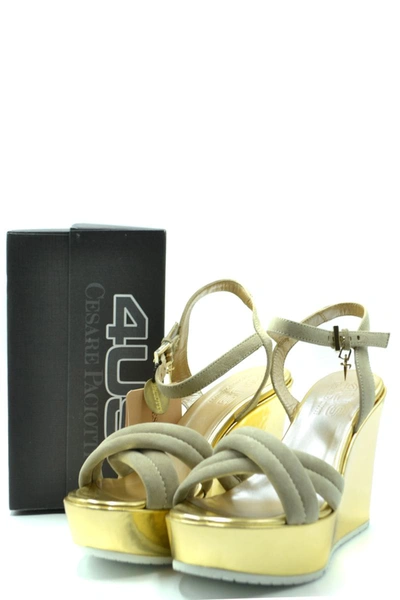 Shop Cesare Paciotti Sandals In Gold