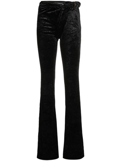 Shop Versace Flared Velvet Trousers In Black