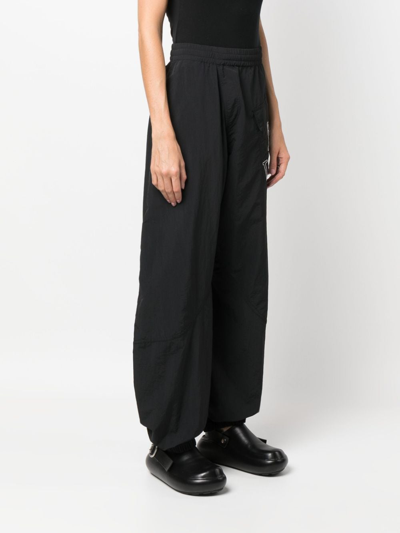 Shop Jw Anderson Logo-embroidered Wide-leg Trousers In Black