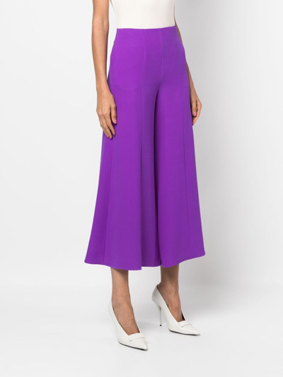 Shop Valentino Cropped Flared Silk Trousers In Purple