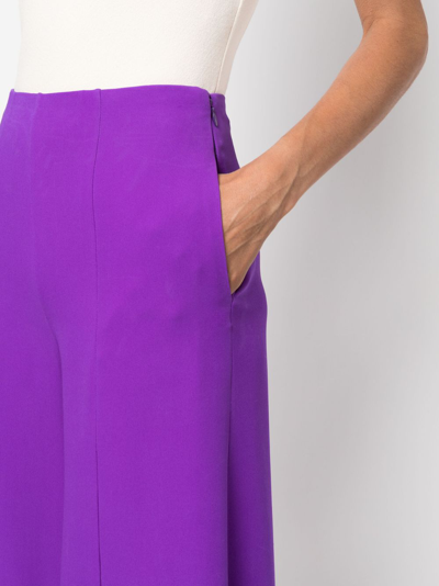 Shop Valentino Cropped Flared Silk Trousers In Purple