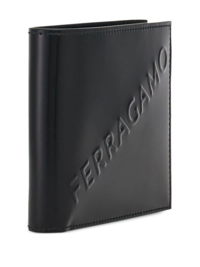 Shop Ferragamo Logo-embossed Bi-fold Wallet In Black