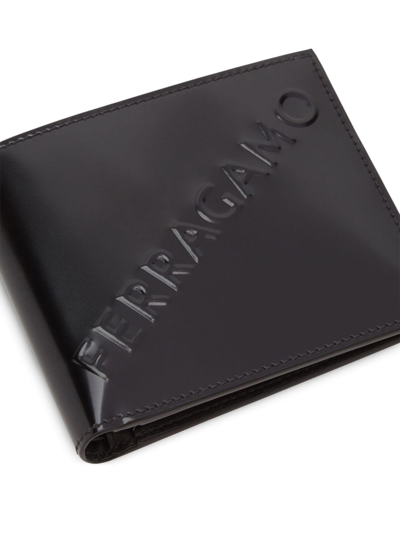 Shop Ferragamo Logo-embossed Bi-fold Wallet In Black