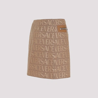 Shop Versace Canvas Logo Mini Skirt In Nude &amp; Neutrals