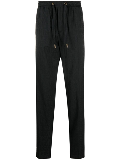 Shop Versace Allover Track Pants In Black