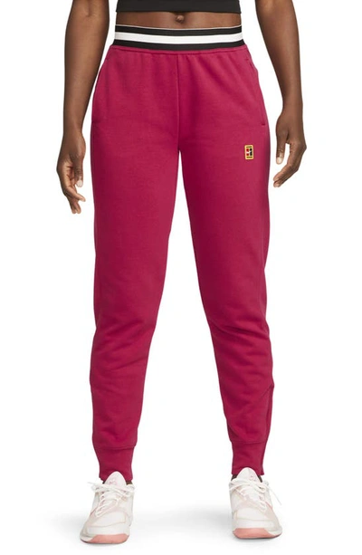 Shop Nike Court Dri-fit Heritage Fleece Pants In Noble Red