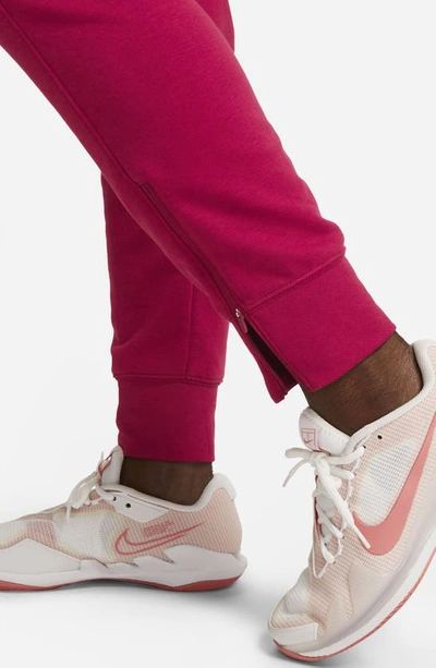 Shop Nike Court Dri-fit Heritage Fleece Pants In Noble Red