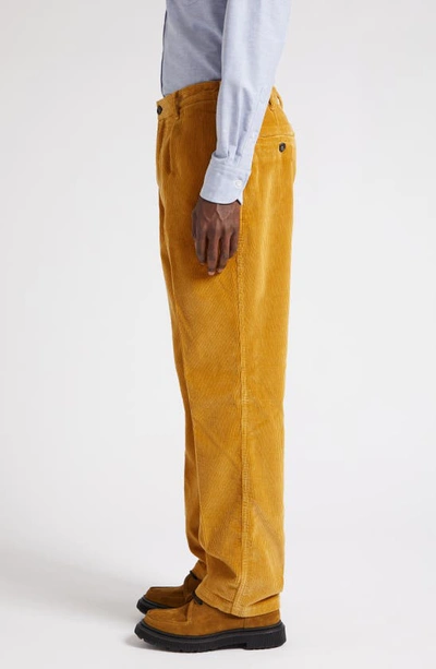Shop Drake's Pleated Corduroy Trousers In Yellow