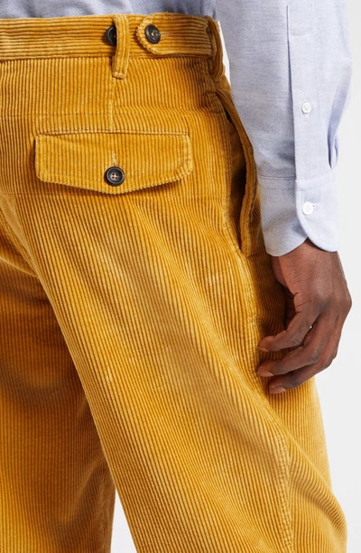 Shop Drake's Pleated Corduroy Trousers In Yellow