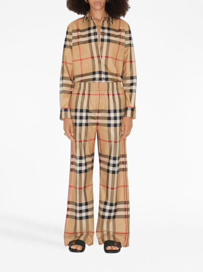 Shop Burberry Check-pattern Flared Cotton Trousers In Nude