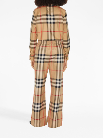 Shop Burberry Check-pattern Flared Cotton Trousers In Nude