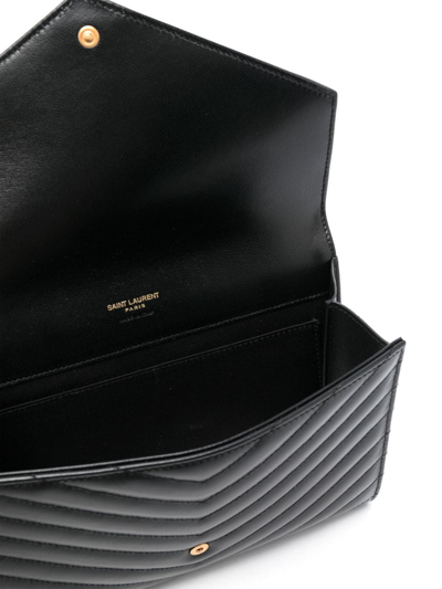 Saint Laurent Cassandre Matelassé Leather Clutch Bag In Schwarz